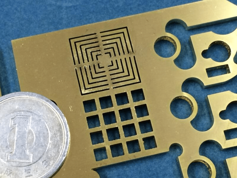 Fiber laser cutting brass sheet with precise holes and slots