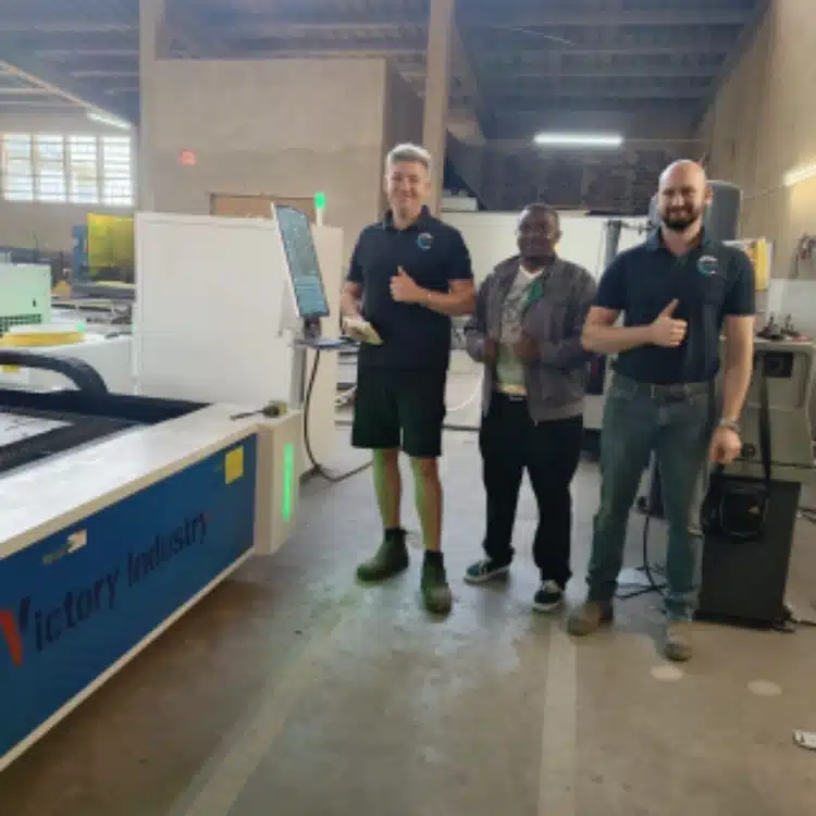 Group photo beside the VT-3015 at KM’s workshop